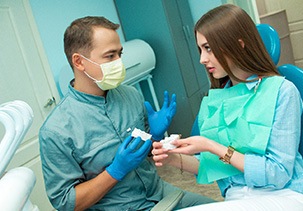 Patient in Jefferson talking to dentist about dental implants