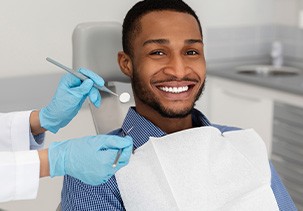 Patient in Jefferson smiling after getting dental implants