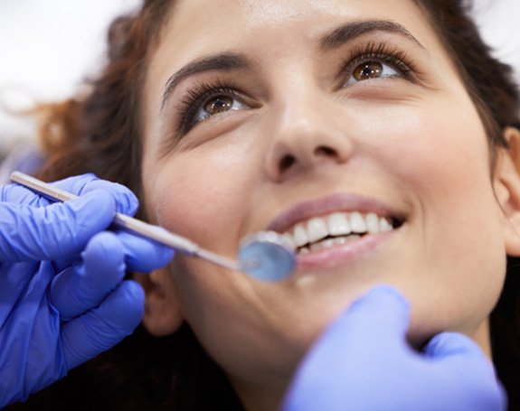 Woman receiving dental checkup